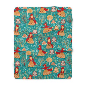 May include: Teal blue fabric with a repeating pattern of red foxes wearing gold skirts and dancing in a forest. The forest is filled with trees, flowers, and leaves.