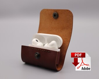 May include: A brown leather case with a snap closure, designed to hold a pair of wireless earbuds. The case is open, revealing the white earbuds inside.