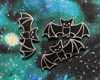 Cute Little Black Bat- Small Hard Enamel Pin- 1.25” across and .5” tall Perfect for Halloween or a board filler. Spooky festive season gift!