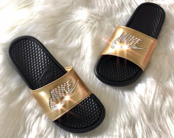 blue nike slides with gold check