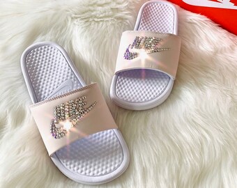 pink and purple nike slides