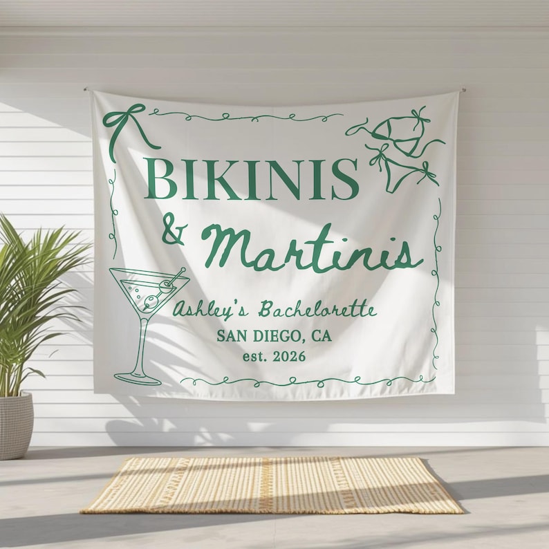 May include: White banner with green text and illustrations. The banner reads "Bikinis & Martinis" with "Ashley's Bachelorette" and "San Diego, CA est. 2026". Includes a martini glass and bikini illustrations.