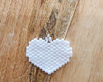 Delicate Necklace with a Beaded White Heart Pendant
