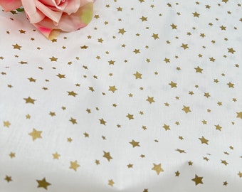 Golden stars on White. Cotton fabric. Wide fabric.