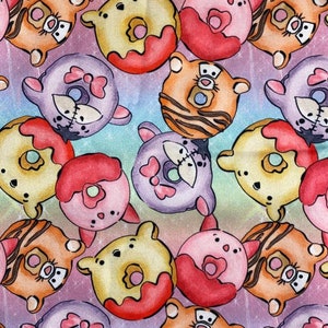 May include: A colorful fabric with a repeating pattern of cartoon donuts. Each donut has a different character face on it, including a bear, a tiger, and a pig. The donuts are all pink, yellow, or purple and have red icing.