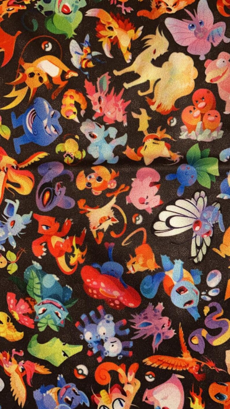 May include: A black fabric with a colorful pattern of various cartoon characters. The characters are all different colors and shapes, and they are arranged in a random pattern. The fabric is perfect for a variety of projects, such as making clothes, bags, or home decor.