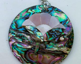 Handcrafted abalone shell floral pendant.