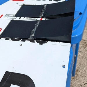 May include: A white ceramic mug with a black handle and the text "But First, Coffee" in a handwritten style. The mug is on a white surface. The mug is approximately 4 inches tall.