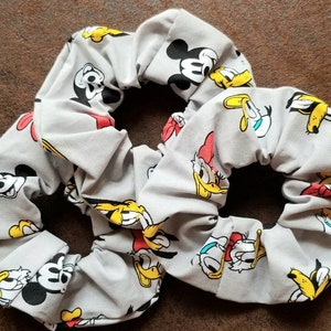 Disney&#39;s Classic Mickey Mouse and Friends Scrunchie (ft. Mickey Mouse, Minnie Mouse, Daisy Duck, Donald Duck, Goofy, and Pluto)