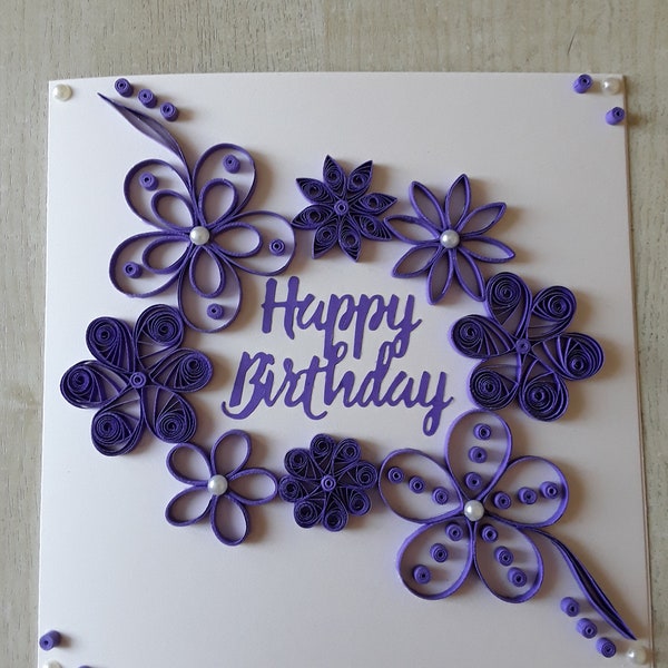 A quilled "Happy Birthday To You" card 7" x 7" Ivory and Purple. Includes a box envelope.
