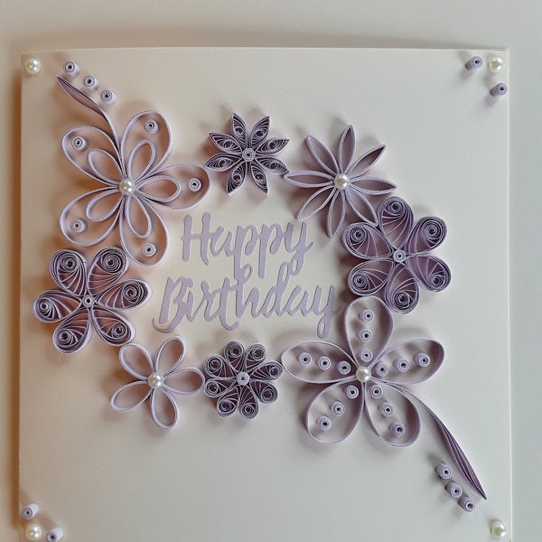 A quilled "Happy Birthday To You" card 7" x 7" Ivory and Lilac. Includes a box envelope.