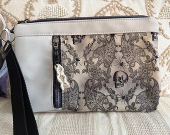 Gorgeous Faux Suede gothic lace effect skulls & spiders wristlet clutch bag  wrist strap included. 2 zip compartments and spider web zippers