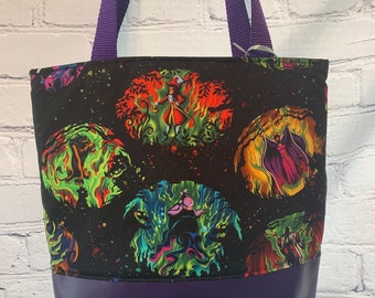 In the style of light show Disney villains tote bag
