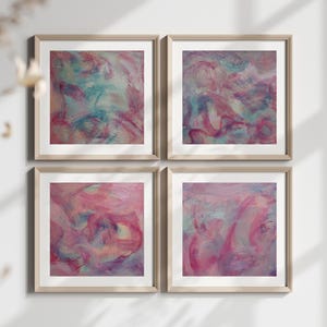 May include: Set of four abstract paintings in a light wood frame. The paintings are all in shades of pink, purple, and blue, with a swirling, abstract design.
