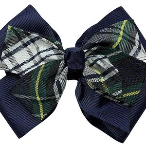 May include: A navy blue bow with a green, white, and yellow plaid pattern. The bow is made of grosgrain ribbon and has a simple design.