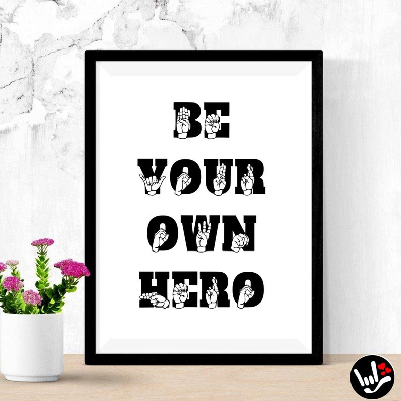 May include: Black and white framed print with the text "BE YOUR OWN HERO" in sign language. The letters are formed by hand shapes.