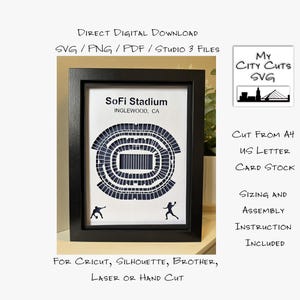 May include: A framed black and white paper cut of SoFi Stadium in Inglewood, CA. The stadium design is in a circular shape with two small figures at the bottom. Text includes "Direct Digital Download" and "My City Cuts SVG".