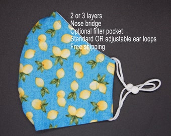 Mascarilla facial con estampado de limón: algodón, alambre para la nariz y tiras ajustables para las orejas.