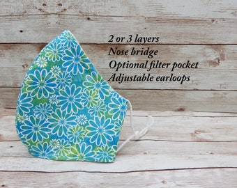 Mascarilla facial de margaritas azules: mascarilla floral de algodón con bolsillo para filtro