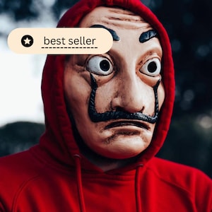 Questa maschera veneziana realizzata artigianalmente con cura, ispirata all'iconica arte di Salvador Dalì, è il regalo perfetto per Halloween
