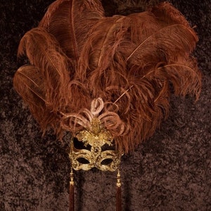 Mask with feather ornament, handmade in Italy. Elegant Venetian craftsmanship. Marcella.
