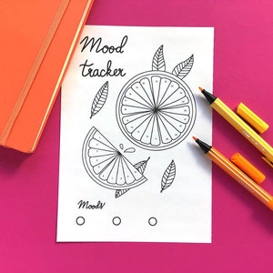 May include: A printable mood tracker with a black and white illustration of a sliced orange. The tracker has numbers 1-31 around the outside of the orange slices. The text "Mood Tracker" is at the top of the page. The text "Moods" is at the bottom of the page with three blank circles.