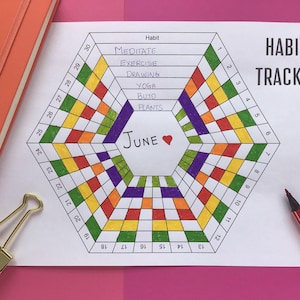 May include: A printable habit tracker for the month of June. The tracker is in the shape of a hexagon with a grid of squares. The squares are colored in red, orange, yellow, green, purple, and white. The tracker includes a list of habits to track, including meditate, exercise, drawing, yoga, build, and plants.