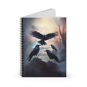 May include: A spiral bound notebook with a black and white illustration of four crows in a misty forest. The text "Spirit Guides" is written in white on the cover.