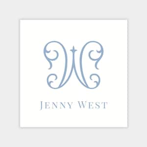 May include: A square white card features a light blue, stylized letter "W" with ornate flourishes. Below the letter, the text "JENNY WEST" is printed in a matching light blue color. The design is simple and elegant.