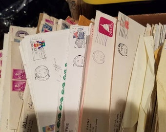 One pound of assorted, old envelopes, with cancelled stamps. Dated from. 1970s through the 1990s. Ephemera. Cancelled stamps.