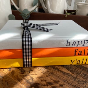 Farmhouse decorative books, stamped books, fall decorative books, fall decor, candy corn colors, happy fall y’all