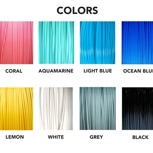 May include: A collection of eight different colored filament spools for 3D printing. The colors are coral, aquamarine, light blue, ocean blue, lemon, white, grey, and black.