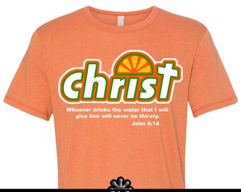 May include: Orange t-shirt with a green and white "christ" graphic with a sun graphic inside the "t". The text "Whoever drinks the water that I will give him will never be thirsty. John 4:14" is below the graphic.