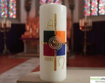 hand-decorated festive Easter candle in ivory, religious