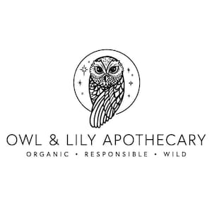 May include: Black and white logo for Owl & Lily Apothecary. The logo features a stylized owl with its wings spread, inside a circle with stars. The text "Owl & Lily Apothecary" is below the owl, with the words "Organic, Responsible, Wild" below the text.