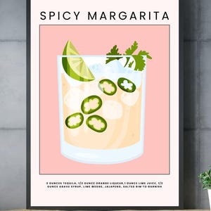 May include: A printable poster with a pink background and a black frame. The poster features a glass of a spicy margarita cocktail with a lime wedge, jalapeno slices, and coriander garnish. The text on the poster reads "Spicy Margarita" and lists the ingredients: 2 ounces tequila, 1/2 ounce orange liqueur, 1 ounce lime juice, 1/2 ounce agave syrup, lime wedge, jalapeno, salted rim to garnish.