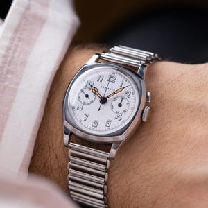 Cronógrafo monopulsador Lemania vintage, rara caja de acero tipo cojín, calibre 13CH, esfera esmaltada de la década de 1930.