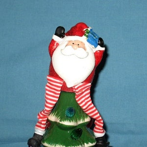 Specialty Ceramic Christmas Tree Topper dangling legs Santa, For Medium to Large Tree Bulbs