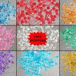 May include: Assortment of 100 clear plastic Christmas tree light bulbs in various colors: blue, red, pink, purple, light blue, and yellow.  FREE SHIPPING.