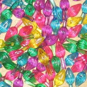 May include: A collection of colorful Christmas light bulbs in various shades of red, green, yellow, blue, and purple. The bulbs are teardrop-shaped and have a glossy finish. The image shows a close-up view of the bulbs.