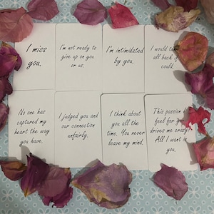 May include: Eight white rectangular cards with black cursive text featuring emotional phrases like I miss you, I am not ready to give up on you or us, I am intimidated by you, I would take it all back if I could, No one has captured my heart, and more.
