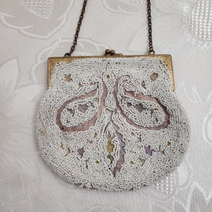 Antique cream glass bead purse with brass frame.