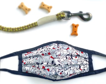 May include: A black face mask with a white background featuring a pattern of cartoon dogs in various poses. The dogs are all grey with red collars and some have red tongues sticking out.