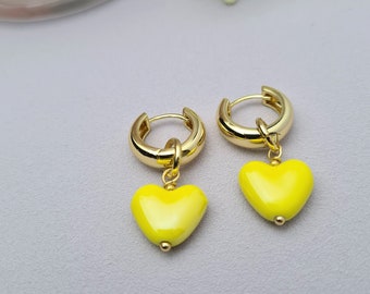Gold plated hoop earrings with heart pendant