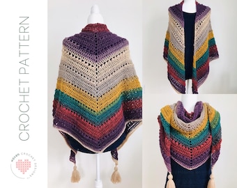 Puede incluir: Un chal de ganchillo multicolor con forma triangular y borlas. El chal está hecho con una variedad de colores, incluyendo morado, rojo, verde, amarillo y beige. El chal se muestra en un maniquí blanco.