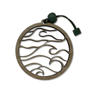 May include: A wooden ornament shaped like a circle with a cutout design of waves. The ornament is attached to a green string with a green bead.