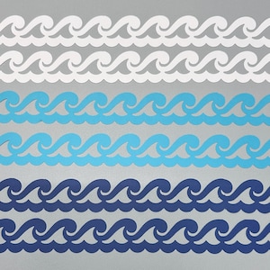 May include: Six horizontal paper die-cut strips featuring a repeating wave pattern. The set includes two white strips, two light blue strips, and two dark blue strips, all arranged in parallel rows to display the continuous ocean wave design.
