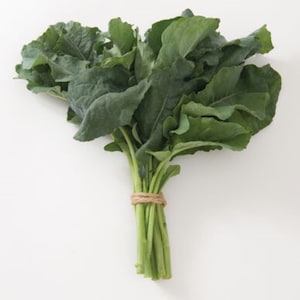 May include: A bunch of fresh green kale tied together with twine.