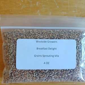 May include: A clear plastic bag filled with a mixture of grains for sprouting. The bag has a white label that reads "Westside Growers", "Breakfast Delight", "Grains Sprouting Mix", and "4 OZ".