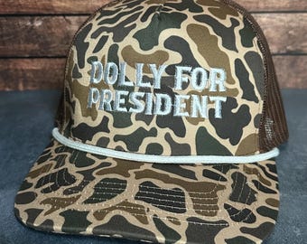 Gorra estilo vintage Dolly For President con bordado de camuflaje y parte trasera de malla, estilo camionero, para hombres y mujeres, con envío gratis.